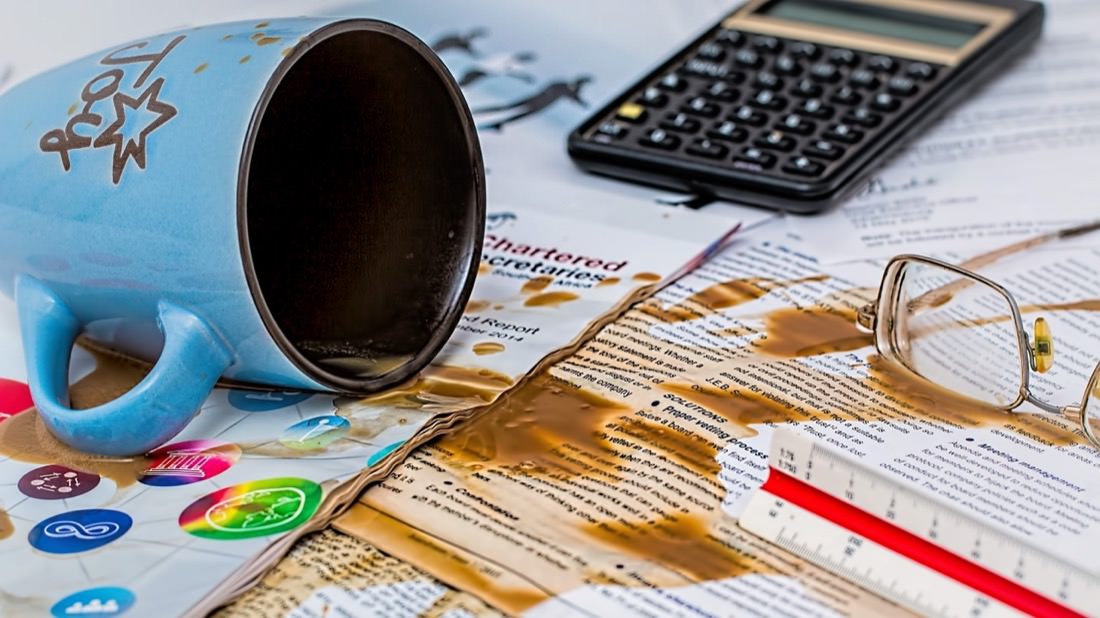 Coffee Spilt over Papers | Photo